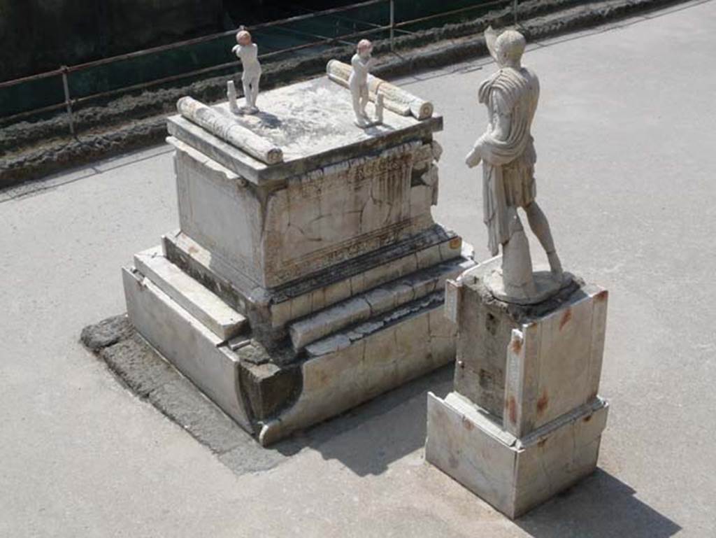 Herculaneum, August 2013.  Memorial altar to Marcus Nonius Balbus and his statue, on the right. Photo courtesy of Buzz Ferebee.